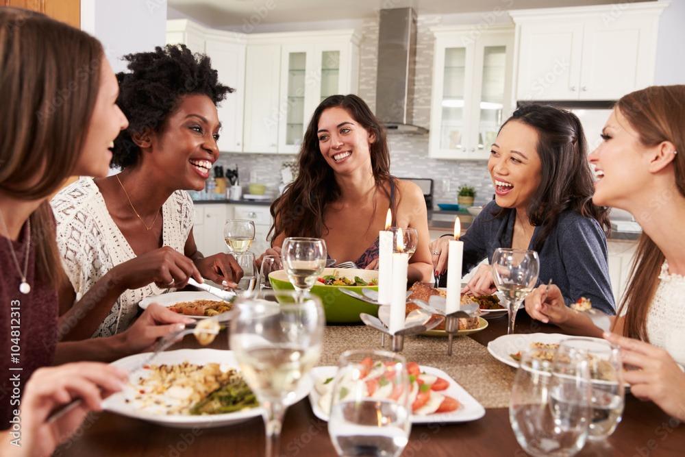 woman setting table for dinner with guests | Ward Realty