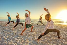 Stretching on the beach | Ward Realty